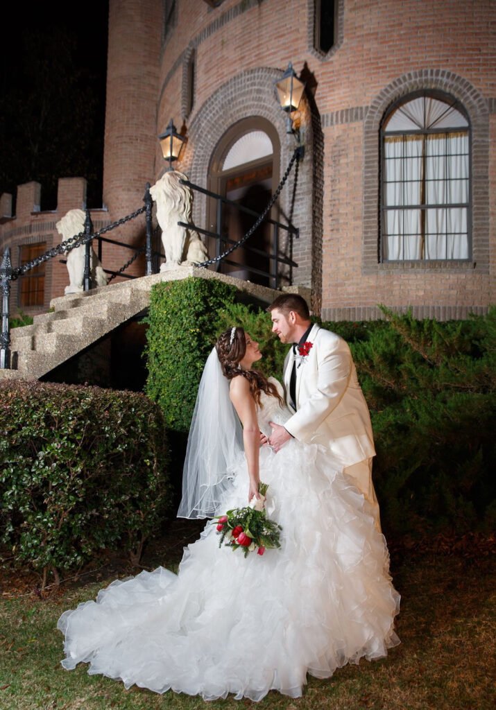 bride and groom outside a castle