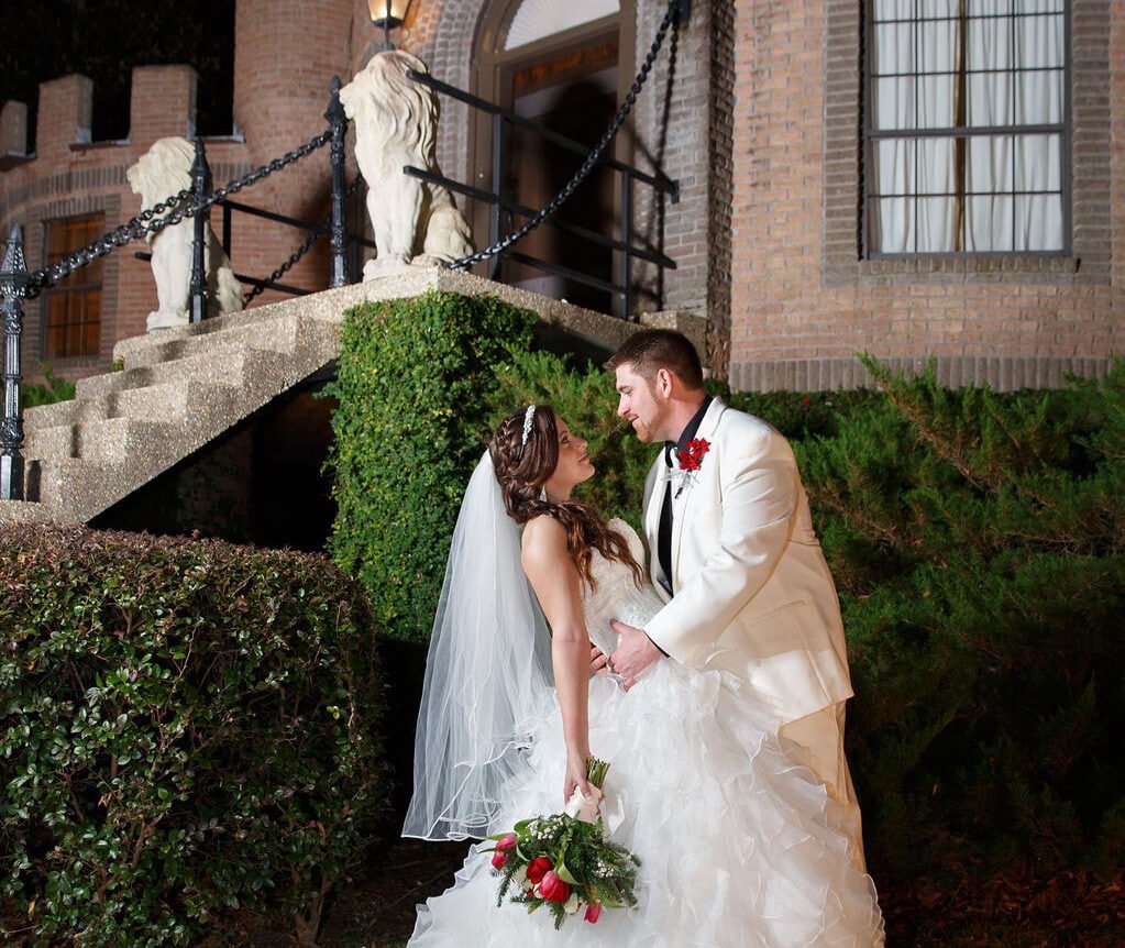 bride and groom outside a castle