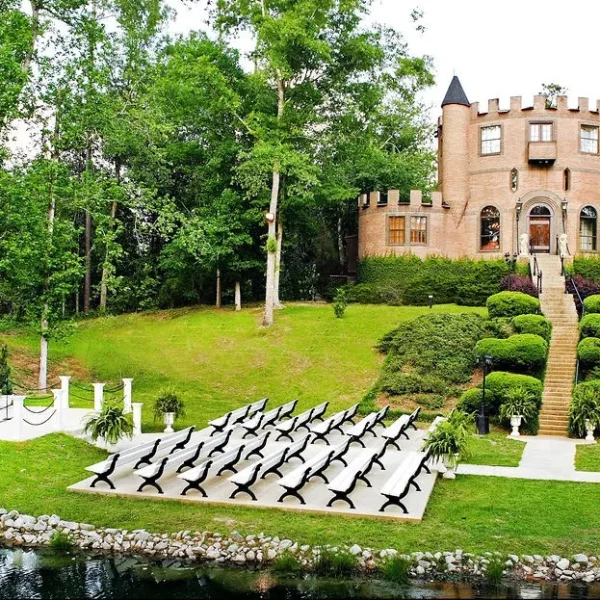 picture of outside of Louisiana Castle wedding venue showing seating, ceremony stage, and castle